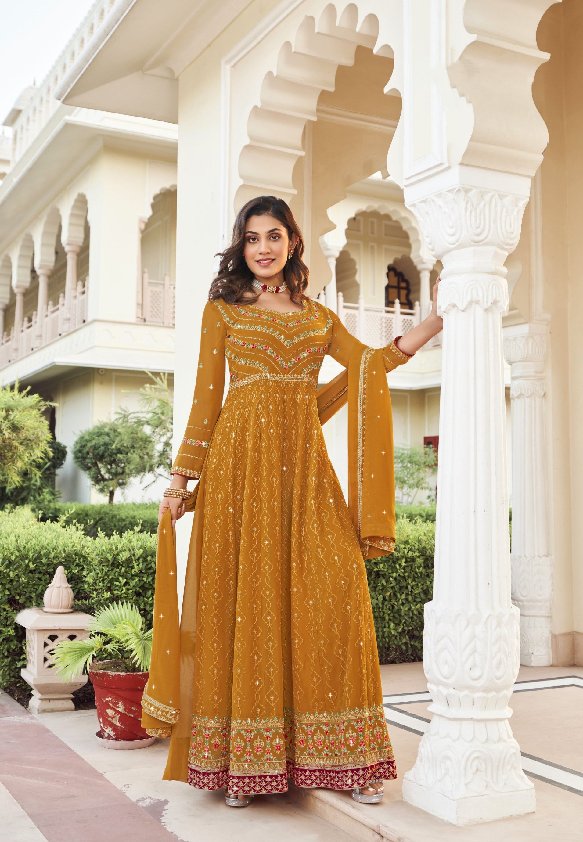 Radiant Yellow Georgette Salwar Kameez adorned with Intricate Embroidery - Elegance Redefined!