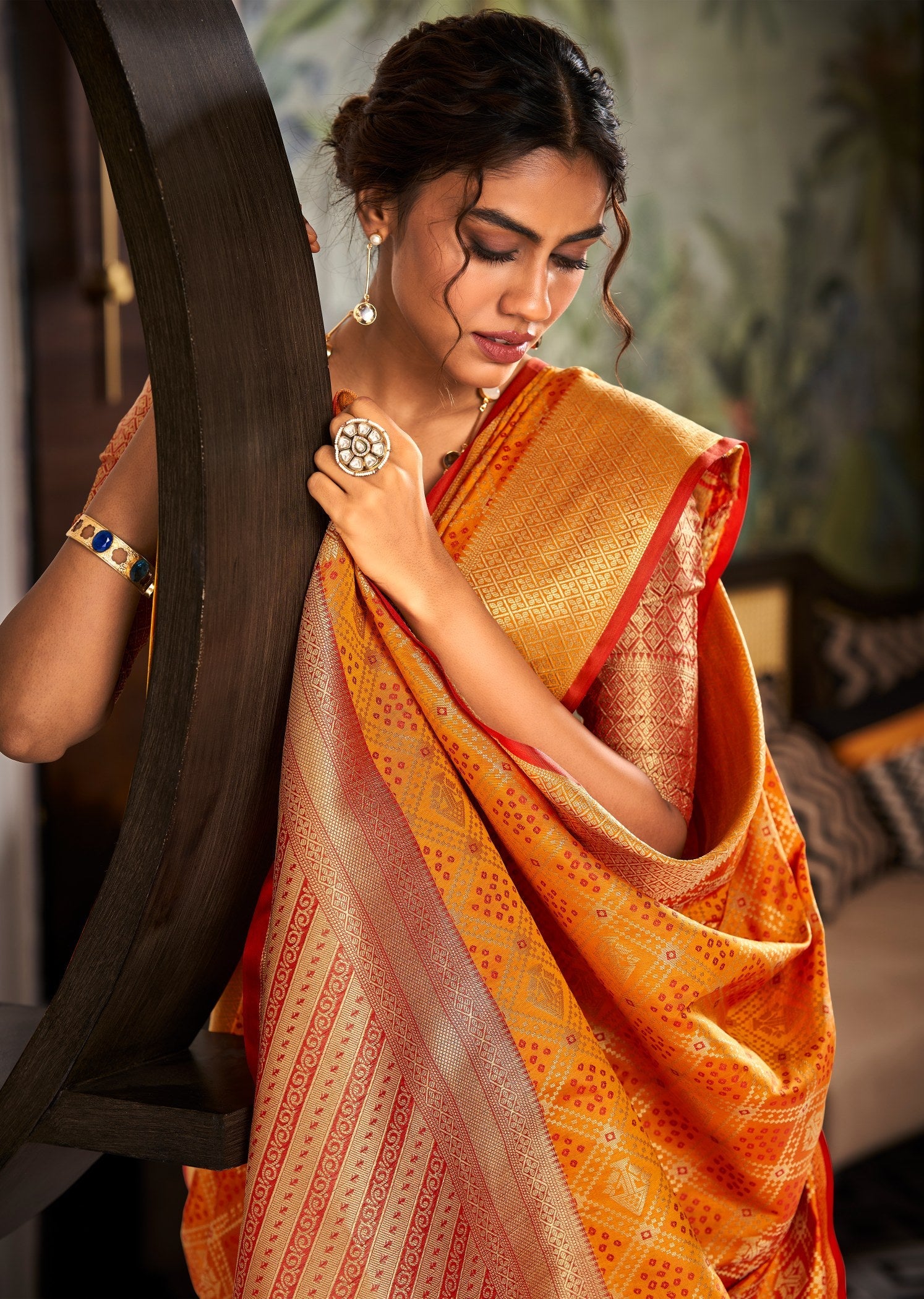 Elegant Orange Patola Saree: Soft Handloom Weaving for Timeless Traditional Charm