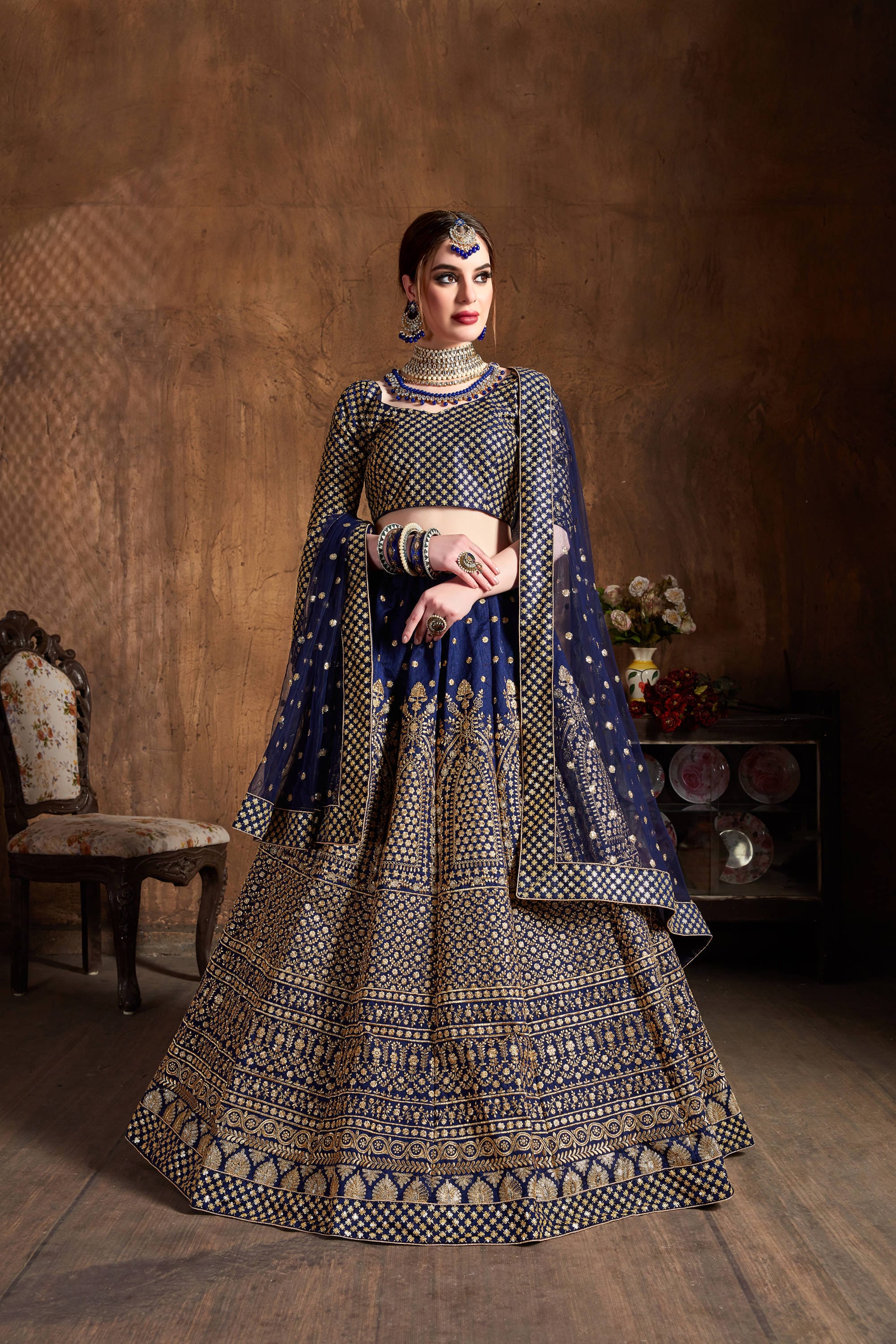 Navy Blue and Gold Jari Lehenga Choli: Glittering Elegance in Raw Silk