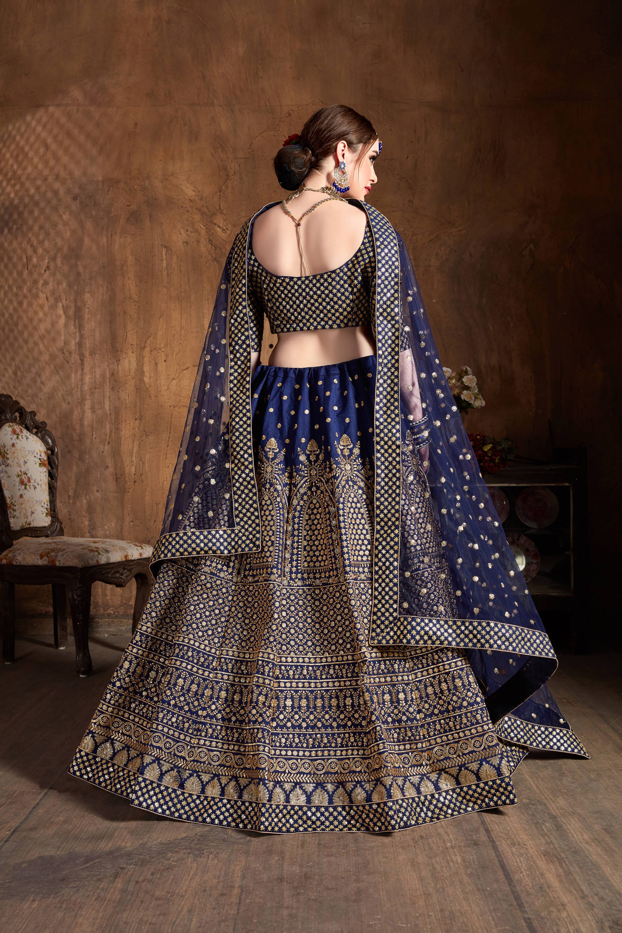 Navy Blue and Gold Jari Lehenga Choli: Glittering Elegance in Raw Silk