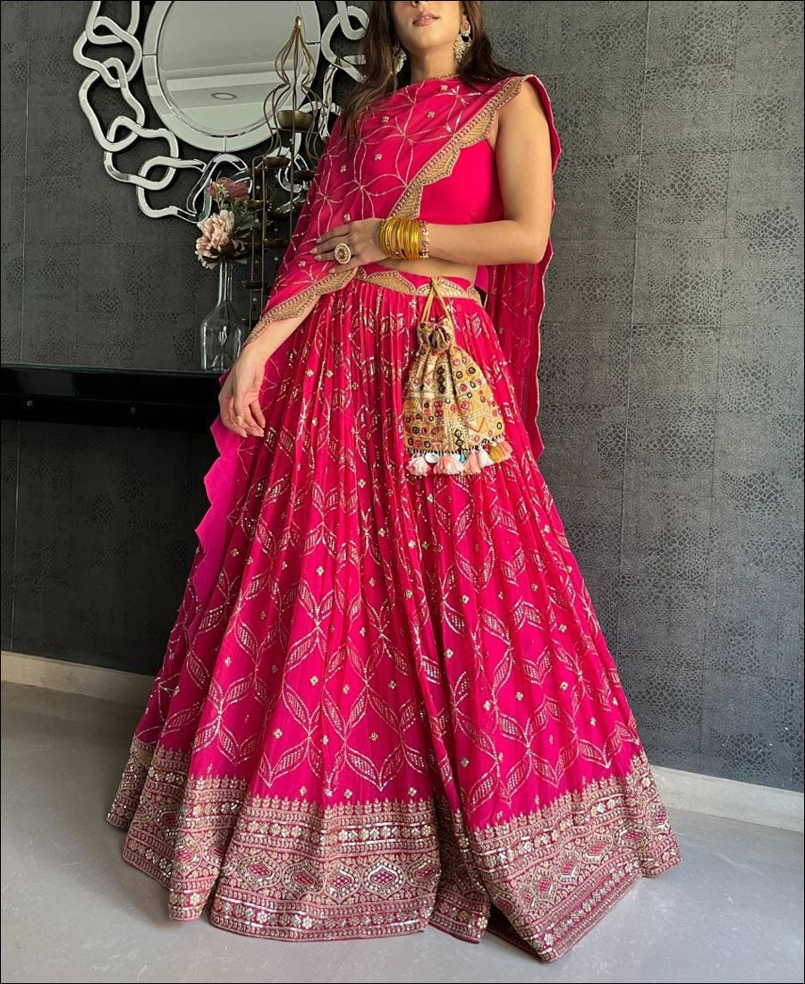 Enchanting Dark Pink Lehenga Choli adorned with Intricate Corded Sequin Embroidery