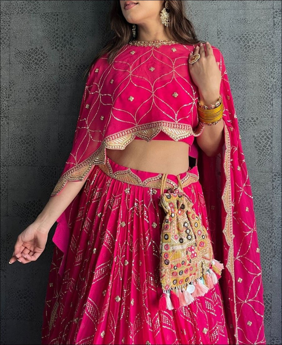 Enchanting Dark Pink Lehenga Choli adorned with Intricate Corded Sequin Embroidery