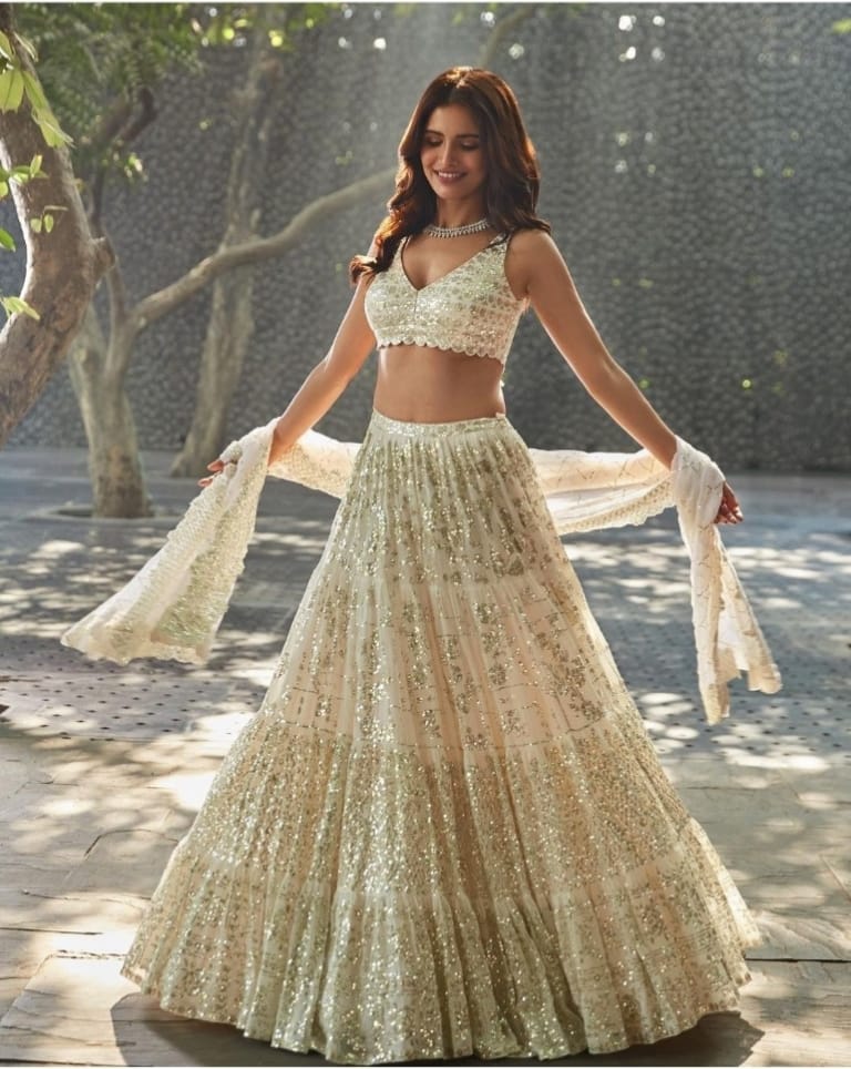 Elegant Off-White Lehenga Choli Adorned with Intricate Thread Sequence Embroidery