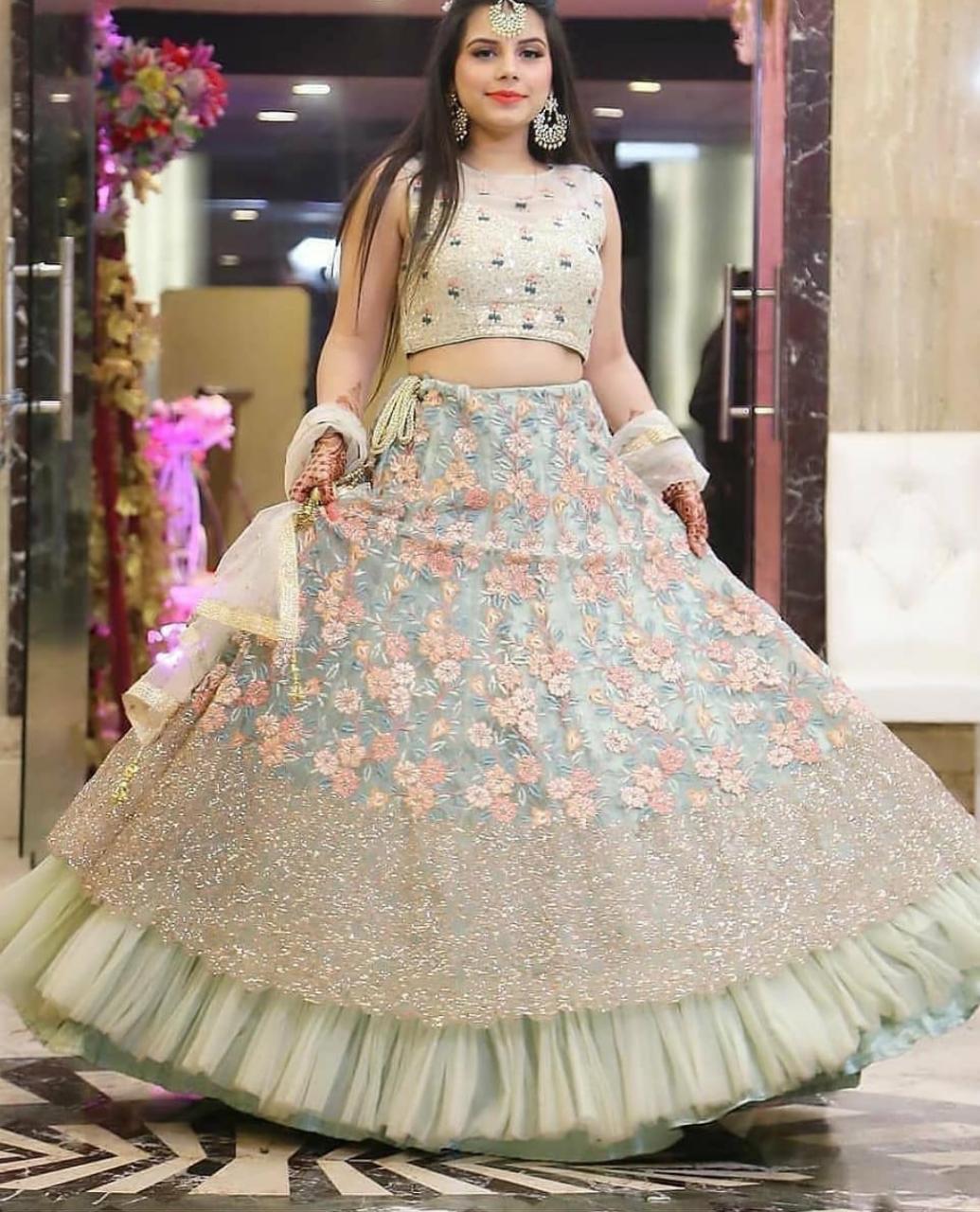 Ethereal Off-Blue Lehenga Choli with Intricate Thread Sequences and Butterfly Net Elegance