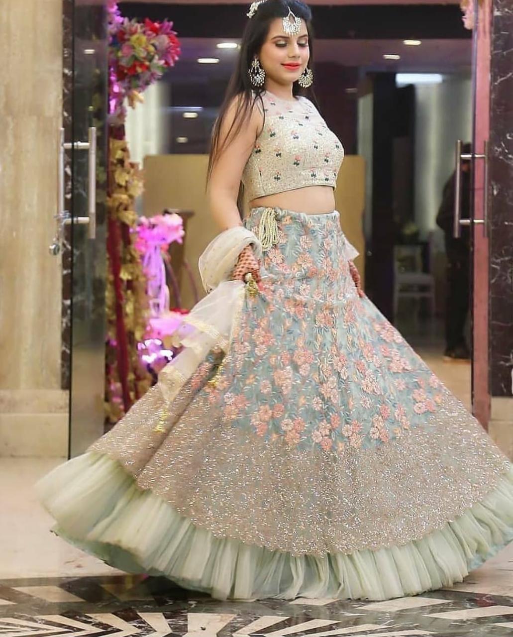 Ethereal Off-Blue Lehenga Choli with Intricate Thread Sequences and Butterfly Net Elegance