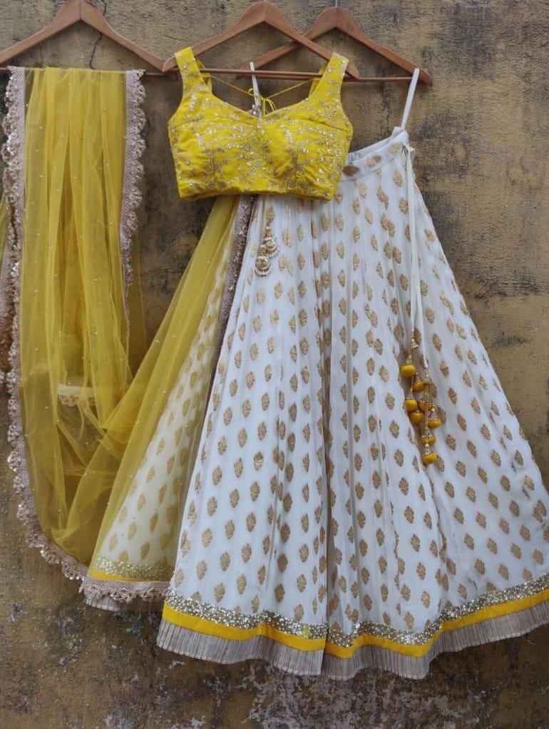 Elegant White-Yellow Lehenga Choli adorned with Intricate Thread-Sequence Embroidery and Banarasi Silk Jacquard