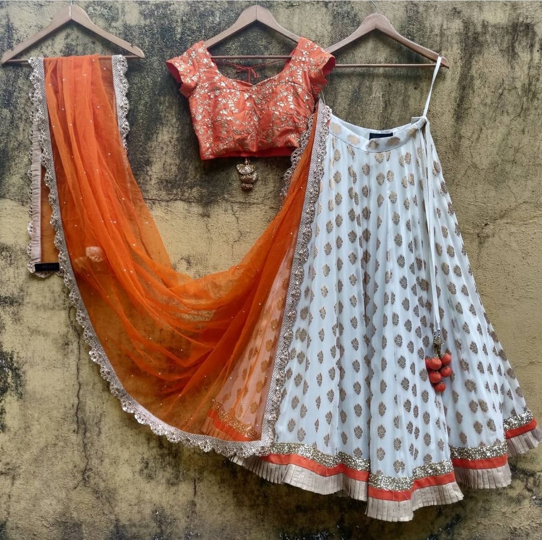 Elegant White-Orange Lehenga Choli with Intricate Thread-Sequence Embroidery and Banarasi Silk Jacquard