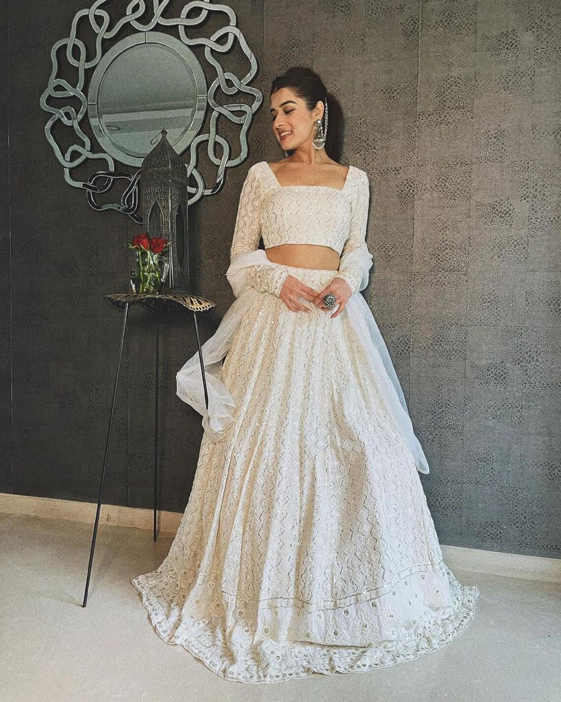 Elegant White Lehenga Choli adorned with Intricate Multi-Thread Sequin Embroidery on Luxurious Faux Georgette