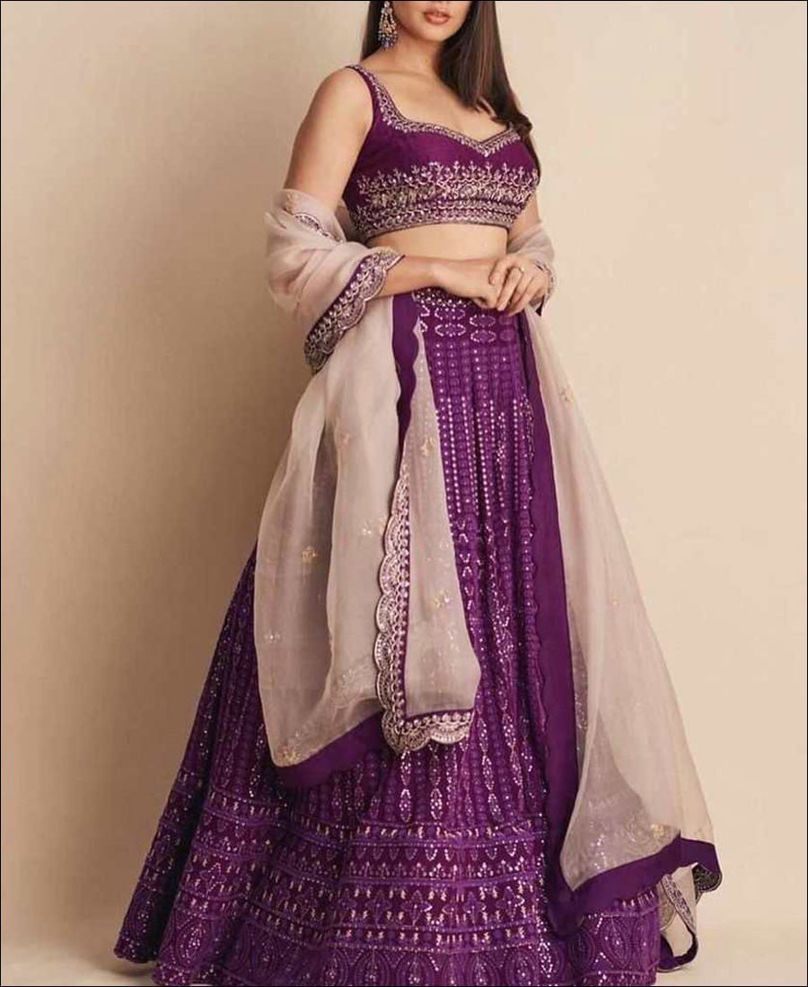 Elegant Purple Lehenga Choli adorned with Intricate Multi-Thread Sequence Embroidery