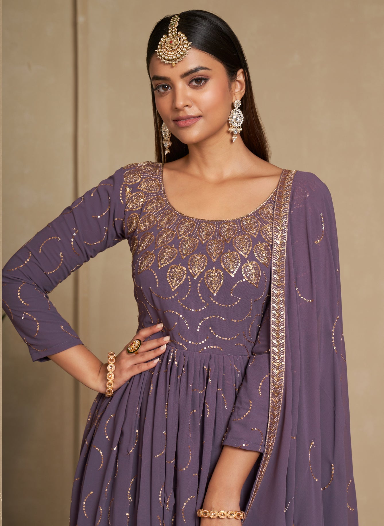 Elegant Purple Zari & Sequins Embroidered Faux Georgette Gown for Weddings & Parties